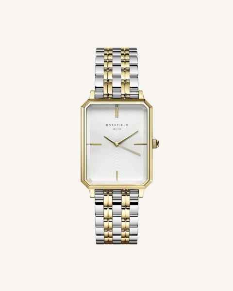 Bicolor Rosefield horloge. De kast van dit Rosefield horloge heeft een rechthoekige vorm en is gemaakt van roestvrijstaal en de band is gemaakt van roestvrijstaal. Beide zijn voorzien van een goudkleurige coating. De wijzerplaat een parelmoeren kleur, met goudkleurige index en wijzers. Dit Rosefield OWSSSG-O48 Bicolor - Horloge is onderdeel van de 'Elles' serie.